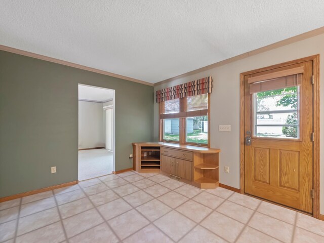 835 Winona Dr SW, Alexandria, MN 56308 - entryway featuring a textured ceiling, plenty of natural light, crown molding, and baseboards