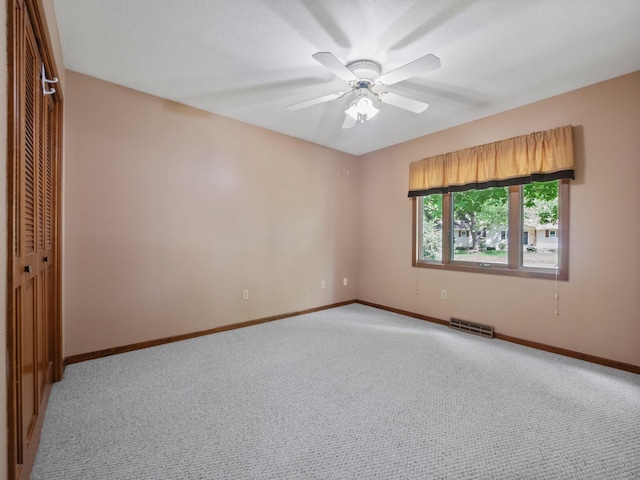 835 Winona Dr SW, Alexandria, MN 56308 - spare room featuring light colored carpet, baseboards, and ceiling fan