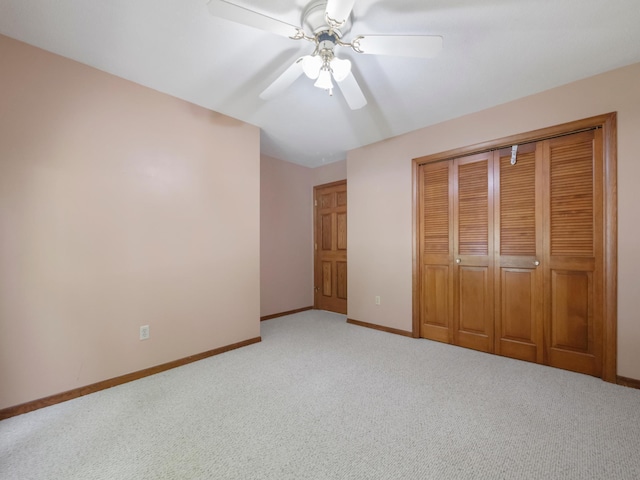 835 Winona Dr SW, Alexandria, MN 56308 - unfurnished bedroom with light carpet, baseboards, a closet, and ceiling fan