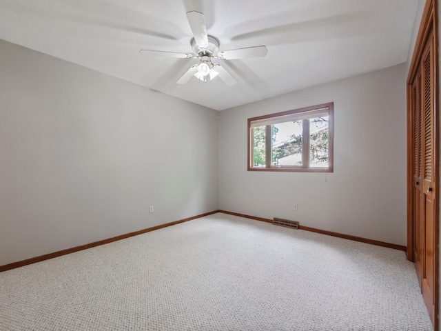 835 Winona Dr SW, Alexandria, MN 56308 - unfurnished bedroom with a closet, light colored carpet, baseboards, and ceiling fan