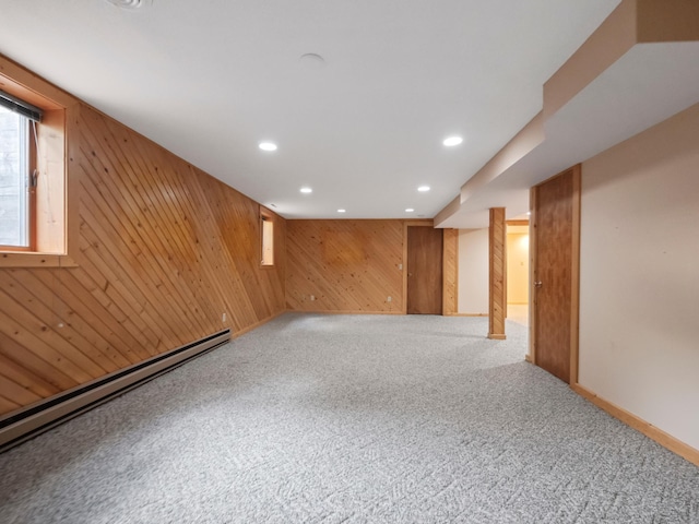 835 Winona Dr SW, Alexandria, MN 56308 - basement with a baseboard radiator, carpet, wood walls, and recessed lighting