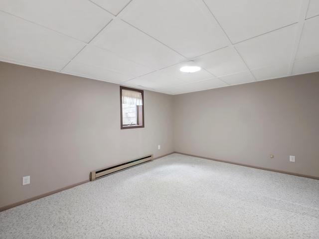 835 Winona Dr SW, Alexandria, MN 56308 - unfurnished room featuring baseboard heating, baseboards, a drop ceiling, and carpet floors