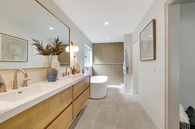 745 Virginia Shores Cir, Victoria, MN 55331 - full bathroom with a freestanding bath, double vanity, recessed lighting, and marble finish flooring