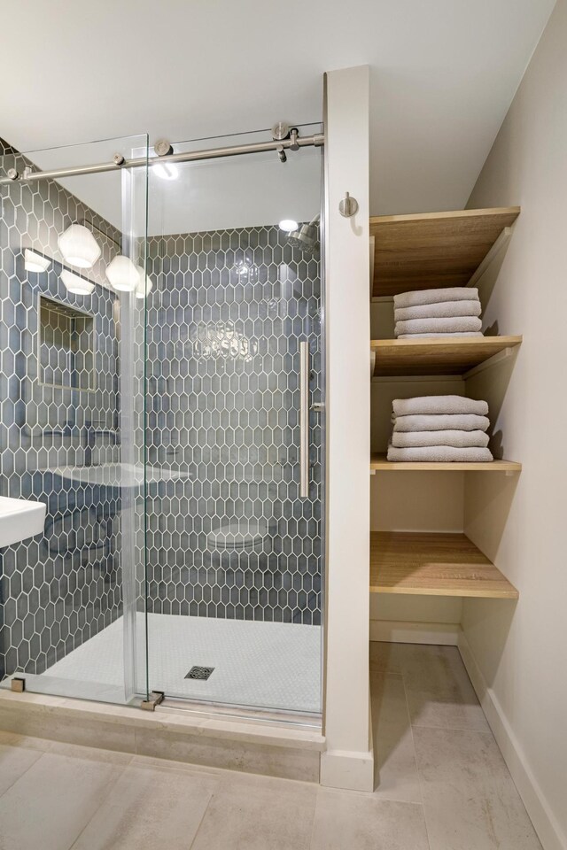 745 Virginia Shores Cir, Victoria, MN 55331 - bathroom with a stall shower and baseboards