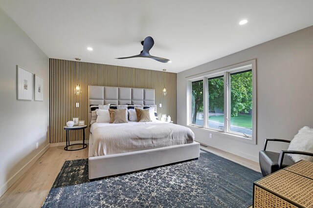 745 Virginia Shores Cir, Victoria, MN 55331 - bedroom with baseboards, an accent wall, wood finished floors, recessed lighting, and ceiling fan