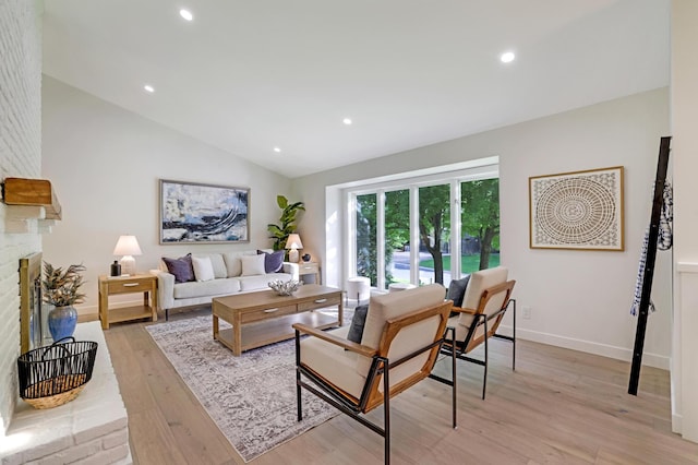 745 Virginia Shores Cir, Victoria, MN 55331 - living room with light wood-style flooring, vaulted ceiling, a fireplace, recessed lighting, and baseboards