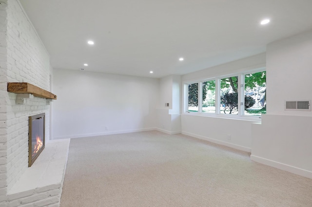 745 Virginia Shores Cir, Victoria, MN 55331 - unfurnished living room featuring recessed lighting, a fireplace, baseboards, and light carpet