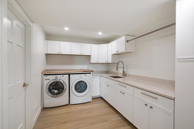 745 Virginia Shores Cir, Victoria, MN 55331 - laundry room with separate washer and dryer, light wood-style floors, recessed lighting, and cabinet space