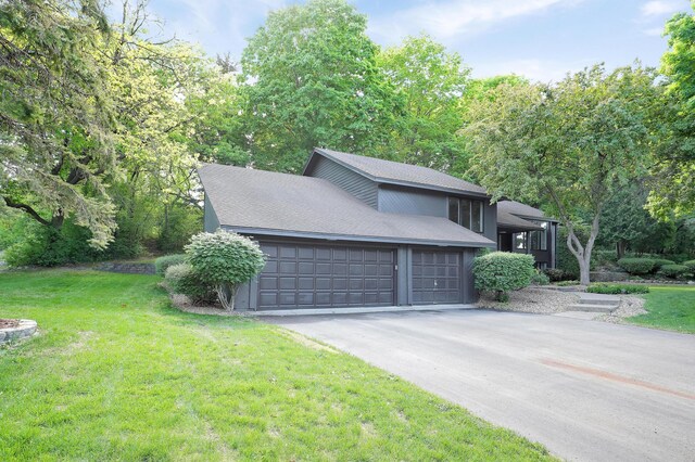 745 Virginia Shores Cir, Victoria, MN 55331 - view of front of property with a front lawn, asphalt driveway, a garage, and a shingled roof