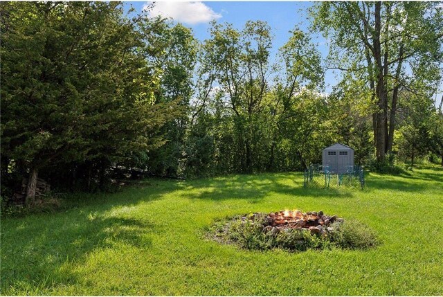 745 Virginia Shores Cir, Victoria, MN 55331 - view of green lawn featuring a fire pit