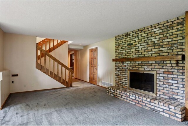 745 Virginia Shores Cir, Victoria, MN 55331 - unfurnished living room featuring carpet flooring, baseboards, a fireplace, stairway, and a textured ceiling