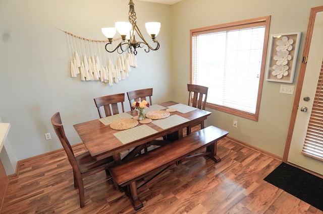 9467 Golden Eagle Ln, Monticello, MN 55362 - dining room featuring a chandelier and wood finished floors