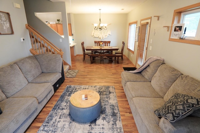 9467 Golden Eagle Ln, Monticello, MN 55362 - living room featuring plenty of natural light, a chandelier, and light wood-type flooring