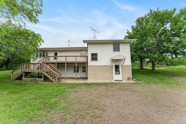 1231 135th St, Amery, WI 54005 - rear view of house featuring stairway, a wooden deck, a lawn, a patio, and stone siding