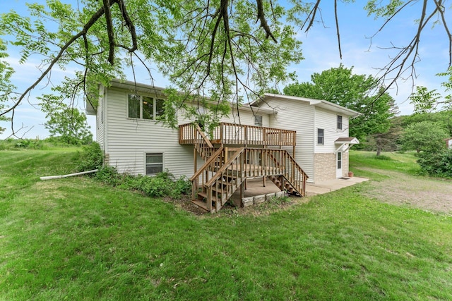 1231 135th St, Amery, WI 54005 - back of property featuring stairway, a wooden deck, and a yard