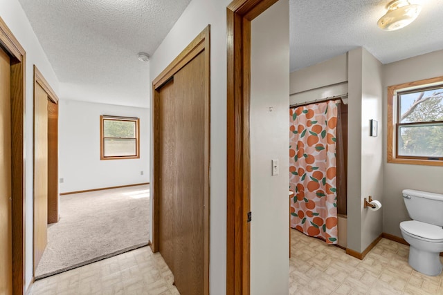 1231 135th St, Amery, WI 54005 - hallway featuring light floors and a textured ceiling