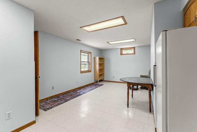 1231 135th St, Amery, WI 54005 - kitchen featuring freestanding refrigerator and baseboards