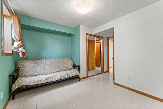 1231 135th St, Amery, WI 54005 - living area with a textured ceiling and baseboards