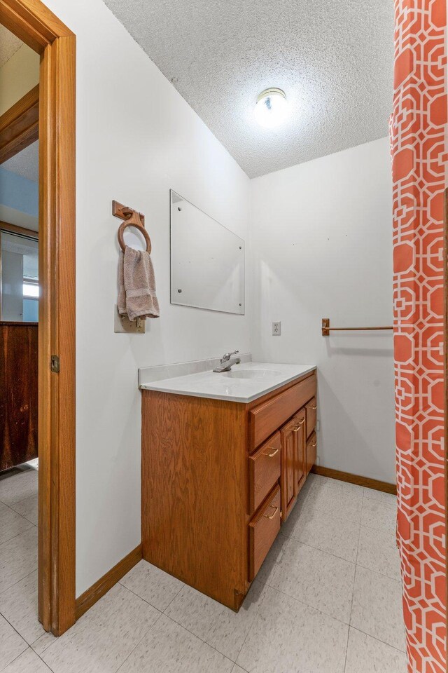 1231 135th St, Amery, WI 54005 - full bathroom with a textured ceiling and vanity