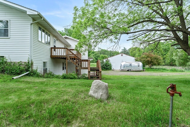 1231 135th St, Amery, WI 54005 - view of grassy yard with stairs and a wooden deck