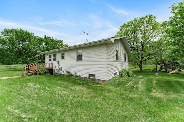 1231 135th St, Amery, WI 54005 - rear view of property with a yard and a playground