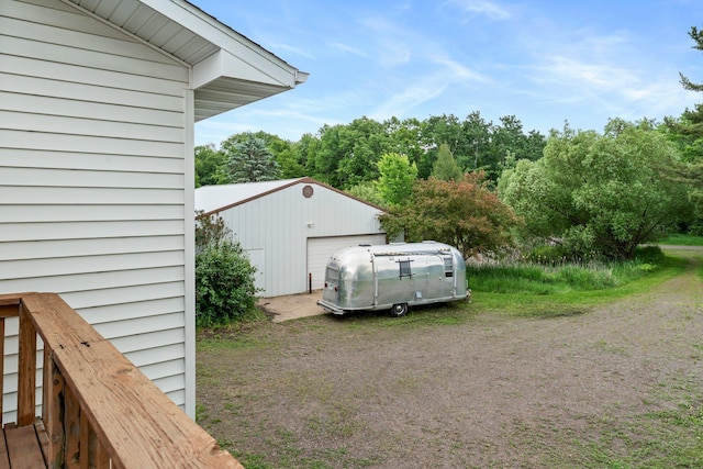 1231 135th St, Amery, WI 54005 - view of yard featuring an outdoor structure and a garage