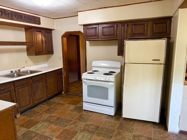 65 6th Ave S, Motley, MN 56466 - kitchen featuring white appliances, a sink, open shelves, stone finish flooring, and light countertops