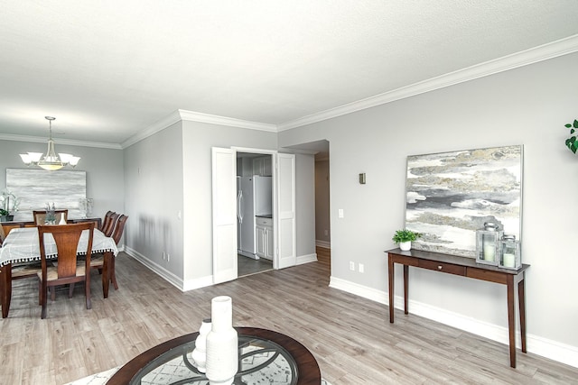 207 5th Ave SW Unit 901, Rochester, MN 55902 - dining room featuring light wood-type flooring, crown molding, a chandelier, and baseboards