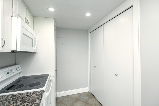 207 5th Ave SW Unit 901, Rochester, MN 55902 - kitchen with white appliances, recessed lighting, baseboards, white cabinetry, and dark countertops