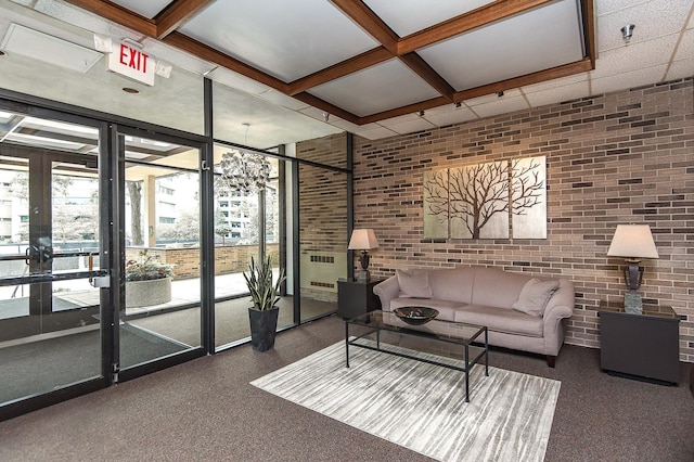 207 5th Ave SW Unit 901, Rochester, MN 55902 - living area with brick wall, carpet, and expansive windows