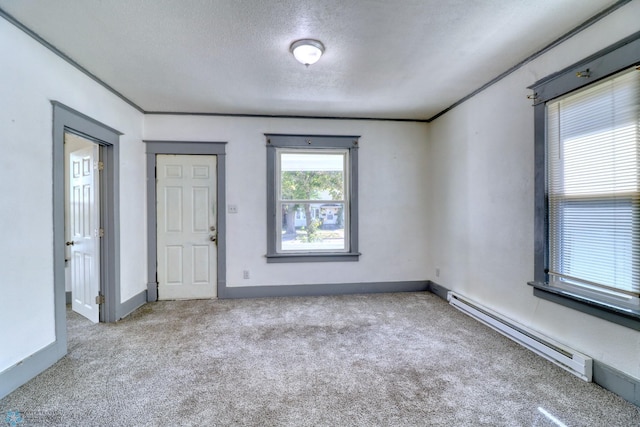 1010 University Dr N, Fargo, ND 58102 - empty room featuring a baseboard radiator, carpet floors, a textured ceiling, and baseboards