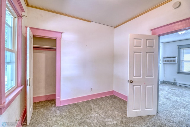 1010 University Dr N, Fargo, ND 58102 - unfurnished bedroom with carpet flooring, crown molding, lofted ceiling, baseboards, and a baseboard radiator