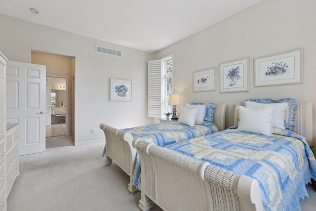 4555 Jewel Ln N, Plymouth, MN 55446 - bedroom with multiple windows, light colored carpet, and baseboards