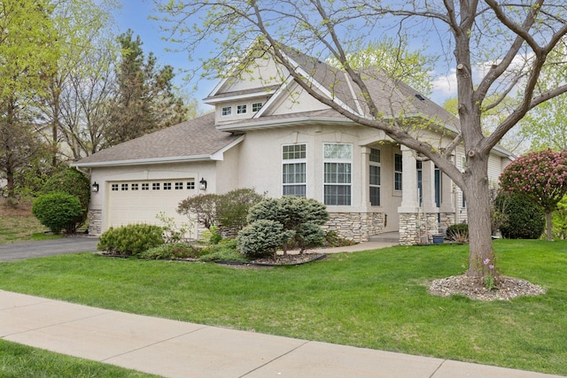 4555 Jewel Ln N, Plymouth, MN 55446 - view of front of home featuring stone siding, stucco siding, an attached garage, driveway, and a front lawn