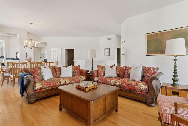 4555 Jewel Ln N, Plymouth, MN 55446 - living room with light wood-style flooring and a chandelier