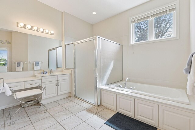 4555 Jewel Ln N, Plymouth, MN 55446 - bathroom featuring vanity, a shower stall, a garden tub, and healthy amount of natural light