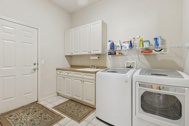 4555 Jewel Ln N, Plymouth, MN 55446 - laundry room with separate washer and dryer, light tile patterned floors, and cabinet space