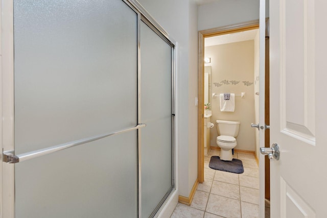 4555 Jewel Ln N, Plymouth, MN 55446 - full bath with a stall shower, toilet, and tile patterned floors