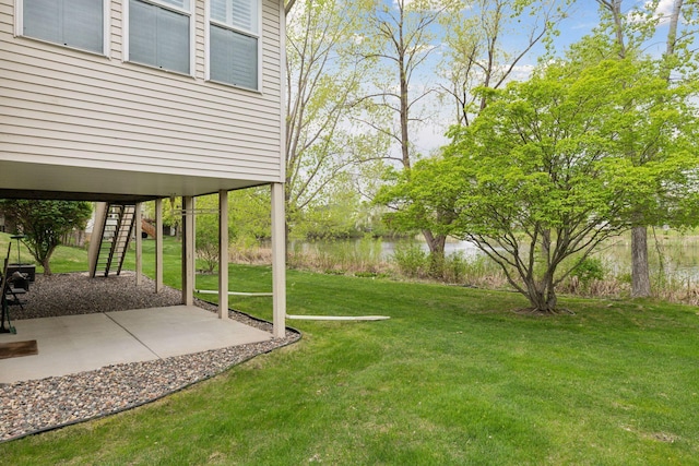 4555 Jewel Ln N, Plymouth, MN 55446 - view of grassy yard with stairway, a patio area, and a water view