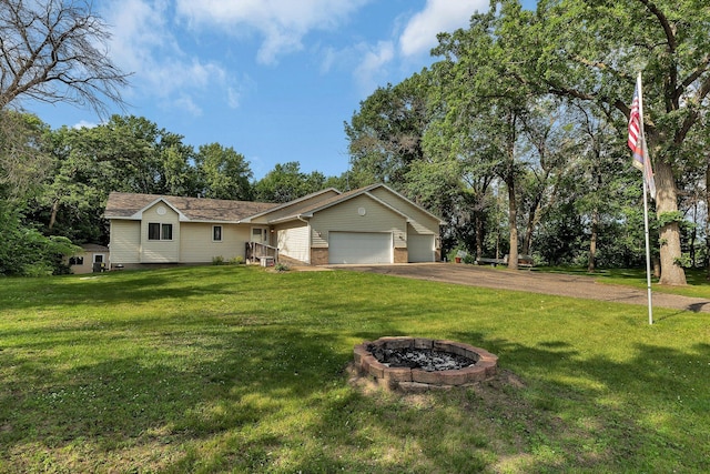16474 63rd St SE, Becker, MN 55308 - ranch-style house with a garage, a front lawn, a fire pit, and driveway