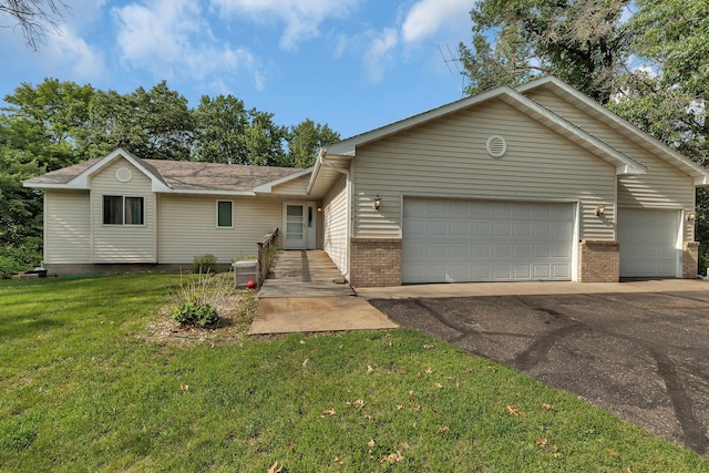16474 63rd St SE, Becker, MN 55308 - ranch-style house featuring brick siding, a front lawn, a garage, and driveway