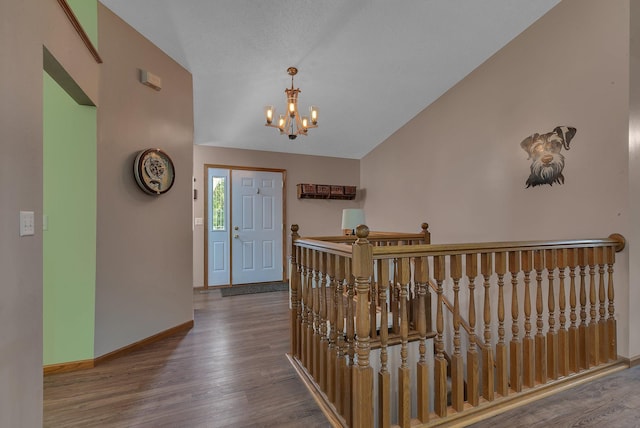 16474 63rd St SE, Becker, MN 55308 - foyer featuring lofted ceiling, a chandelier, and wood finished floors