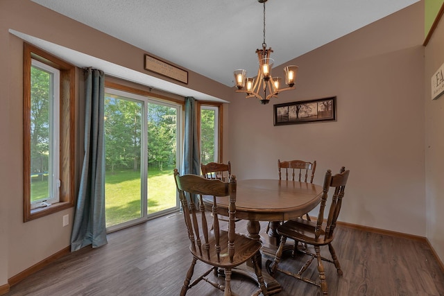 16474 63rd St SE, Becker, MN 55308 - dining room with plenty of natural light, wood finished floors, a chandelier, and vaulted ceiling
