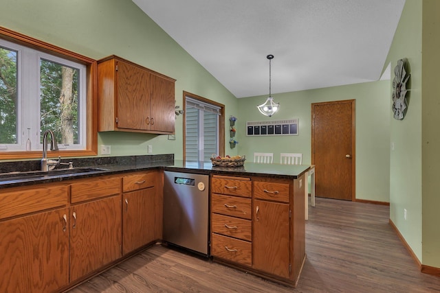 16474 63rd St SE, Becker, MN 55308 - kitchen with dishwasher, vaulted ceiling, a peninsula, dark wood-style flooring, and brown cabinets