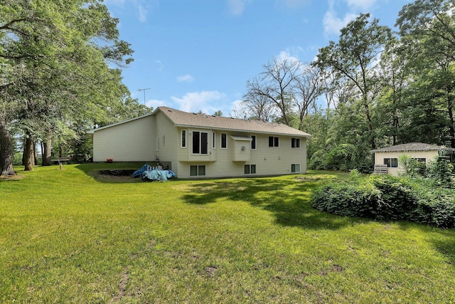 16474 63rd St SE, Becker, MN 55308 - rear view of house featuring a yard