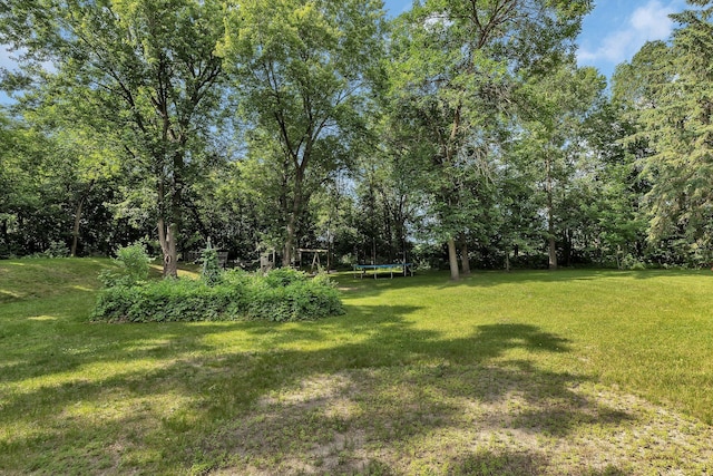 16474 63rd St SE, Becker, MN 55308 - view of green lawn with a trampoline