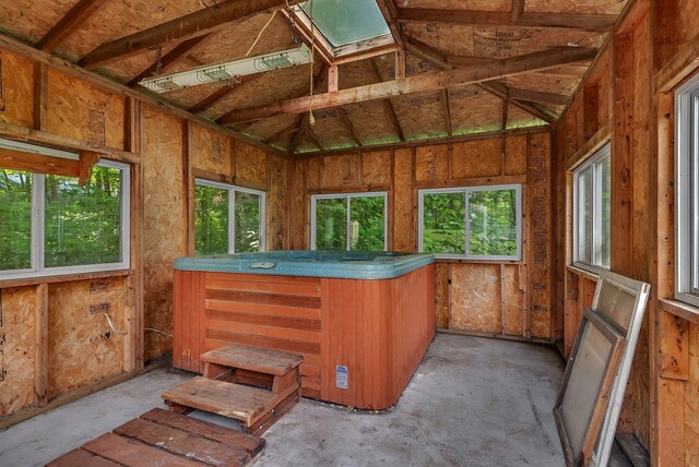 16474 63rd St SE, Becker, MN 55308 - miscellaneous room featuring a skylight, healthy amount of natural light, and unfinished concrete floors