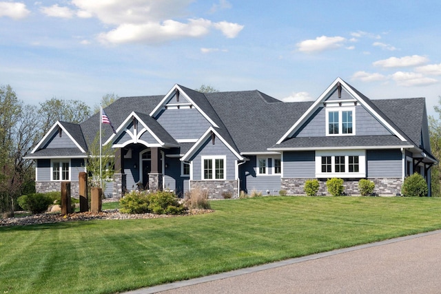 16331 Royal Rd, Ramsey, MN 55303 - craftsman inspired home with stone siding, a front lawn, and a shingled roof