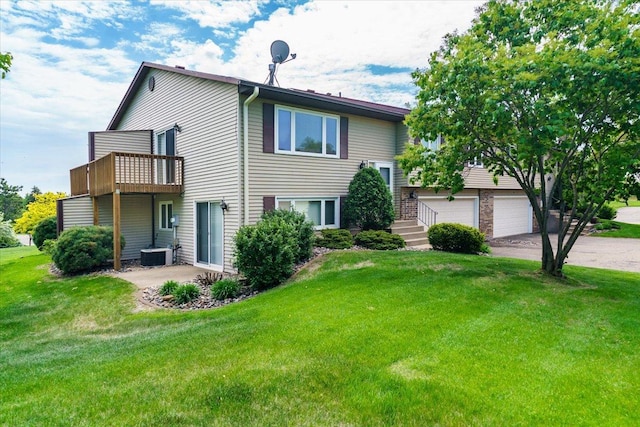 10382 Juniper Ln, Eden Prairie, MN 55347 - rear view of property with a lawn, driveway, and a garage