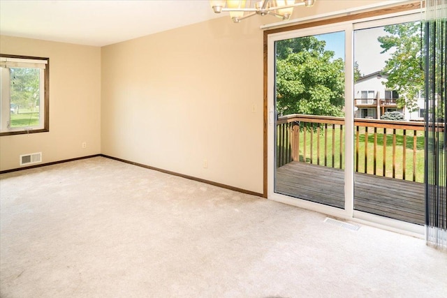10382 Juniper Ln, Eden Prairie, MN 55347 - carpeted spare room with a chandelier and baseboards
